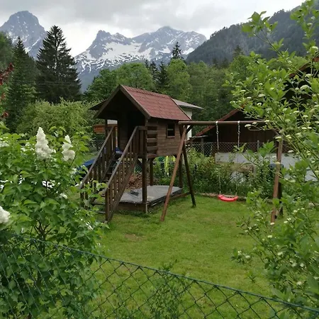 Holzhaus In *