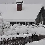 Holzhaus In *