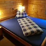 Holzhaus In *